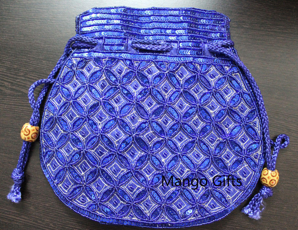 Beautiful blue handmade Indian potli bag adorned with sequins, perfect for fashion and small articles.